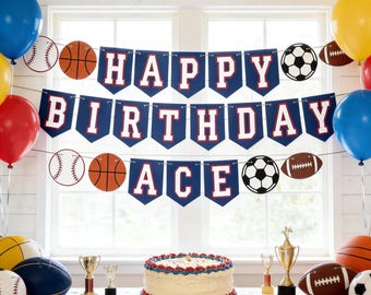 May include: A festive birthday party scene with a banner that reads "HAPPY BIRTHDAY ACE". The banner is blue with white and red lettering. Balloons in blue, yellow, and red are scattered around the room. A cake and sports-themed decorations complete the celebratory atmosphere.
