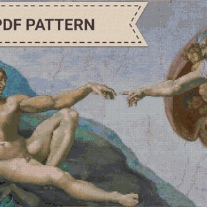 Puede incluir: Un patrón de punto de cruz de la famosa pintura renacentista de Miguel Ángel, "La Creación de Adán". El patrón representa a Dios tendiéndole la mano a Adán, con un grupo de ángeles rodeando a Dios.
