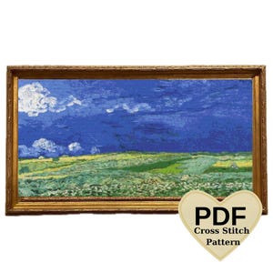May include: A cross stitch pattern PDF for a painting of a blue sky with white clouds over a green field. The pattern is in a gold frame.