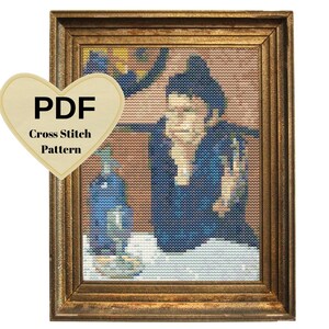 May include: A PDF cross stitch pattern featuring a woman in a blue dress and a blue beret, sitting at a table with a bottle and a glass. The pattern is framed in a gold frame.