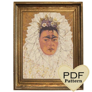 May include: A framed cross-stitch pattern of Frida Kahlo wearing a white lace veil and a flower crown. The pattern is in a gold frame and has a heart-shaped label that says "PDF Pattern".