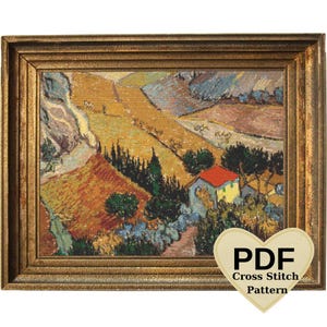 May include: A cross stitch pattern depicting a landscape with a small house, trees, and rolling hills. The pattern is in a gold frame and has a PDF label.