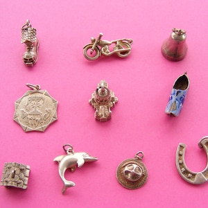 May include: A set of three ceramic mugs with a speckled, matte finish. The mugs are in shades of cream, light gray, and dark gray. Each mug has a simple, modern design and a rounded handle. The mugs are stacked on top of each other.