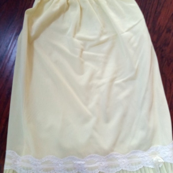 Vintage Half Slip- Nylon- Pretty light yellow color with ruffle at hem- no tag- I would say it's a size S