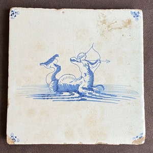 c.1650 Delft Tile 5 1/4in SQ handmade & painted Blue on White of Merman w/ Bow/Ox-Head Corners Tin Glazed Earthenware Blueware Dutch Holland