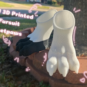 May include: White and black 3D printed fursuit feetpaws. The feetpaws are white with black paw pads and are designed to resemble animal feet. The text "TPU 3D Printed Fursuit Feetpaws" is in the image.