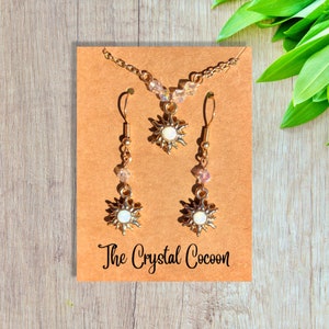 Gold Crystal Sun Charm Earring and Necklace Jewelry Set. Beaded Iridescent Crystal Sun Charm Necklace and Earring Set in Gold.