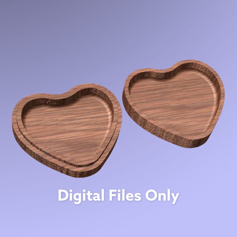 Puede incluir: Dos bandejas de madera en forma de coraz&oacute;n con un patr&oacute;n de veta visible, mostradas desde un &aacute;ngulo elevado. Las bandejas cuentan con un centro rebajado y bordes elevados. El texto "Digital Files Only" aparece en blanco en la parte inferior.