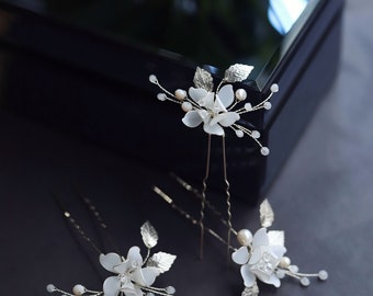 Hairpins with magnolia flowers