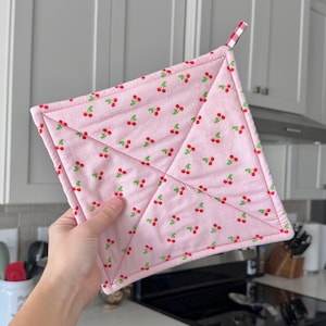 May include: A set of three ceramic mugs with a speckled, matte finish. The mugs are in shades of cream, light gray, and dark gray. Each mug has a simple, minimalist design, perfect for coffee or tea.