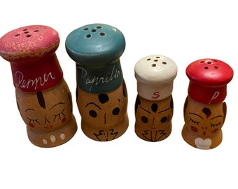 Two pair Vintage Made in Japan Wooden Salt and & Pepper Shakers with Faces. Cork stoppers.