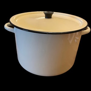 May include: White enamel pot with a black rim and a black knob on the lid.