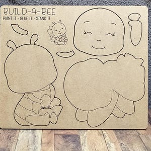 May include: Build-A-Bee craft kit with instructions to paint, glue, and stand the pieces. The kit includes a bee body, wings, head, and flower.