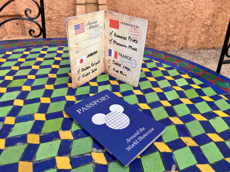 Around the World Showcase Passport, the best way to explore EPCOT's World Showcase and record all the food and drink you enjoy on the journey. Sized like an actual passport, 3.5" x 5", saddle-stitched, 12 page booklet, 80# cover stock.