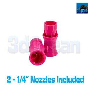 May include: Four bright pink nozzles are displayed against a white background. The nozzles are cylindrical with a flared top and a ridged, hourglass-shaped body. The text "2-1/4" Nozzles Included" is at the bottom of the image.
