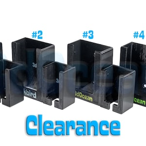 以下が含まれることがあります： 4つの黒い金属製ブラケットのセット。それぞれデザインとサイズが異なり、#1から#4まで番号が振られています。「3dOcean」の文字が一部のブラケットに表示され、「Clearance」の文字が青色で表示されています。