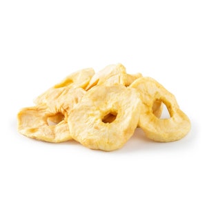May include: A pile of dried apple rings, featuring a light tan color and a slightly wrinkled texture. The apple slices have a circular shape with a hole in the center, suggesting a healthy snack or ingredient for baking.