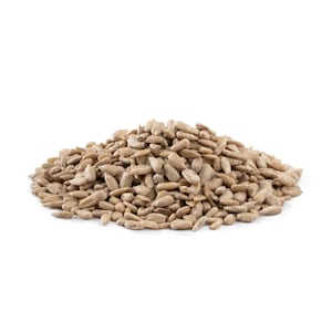 May include: A close-up of a pile of raw, unhulled sunflower seeds. The seeds are a light brown color and have a slightly rough texture.