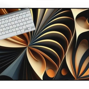 May include: Abstract design mouse pad with a swirling pattern of black, gold, and cream colored paper. A white keyboard and mouse are on the pad.