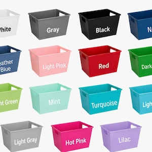 May include: A collection of fourteen rectangular plastic storage bins with integrated side handles, displayed in a grid. Each bin is a solid color, labeled with text: White, Gray, Black, Navy, Heather Blue, Light Pink, Red, Dark Green, Light Green, Mint, Turquoise, Light Blue, Light Gray, Hot Pink, and Lilac.