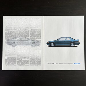 May include: A blue Honda Accord SE Coupe is parked on a white surface. The car has a black interior and a black license plate. The text "The Accord SE Coupe. It makes quite an impression." is printed below the car.