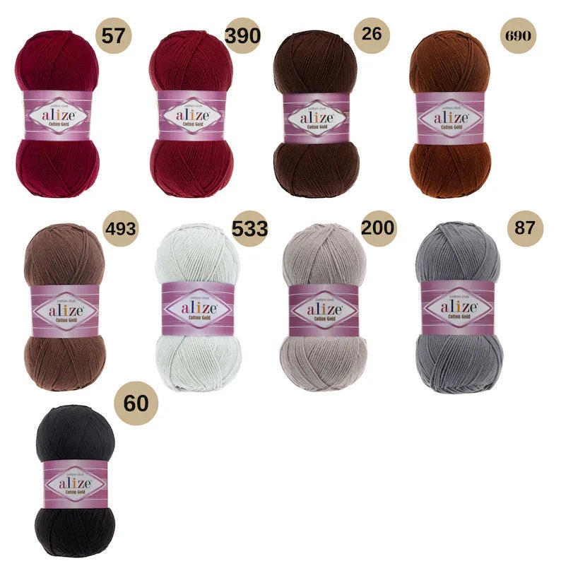 May include: Assortment of ten balls of yarn in various colours, including red, brown, beige, grey, and black. Each ball has a label that reads "alize cotton gold".