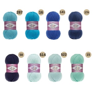 May include: Assortment of eight skeins of Alize Cotton Gold yarn in various shades of blue, green, and turquoise. Each skein has a label with the brand name and the yarn weight.