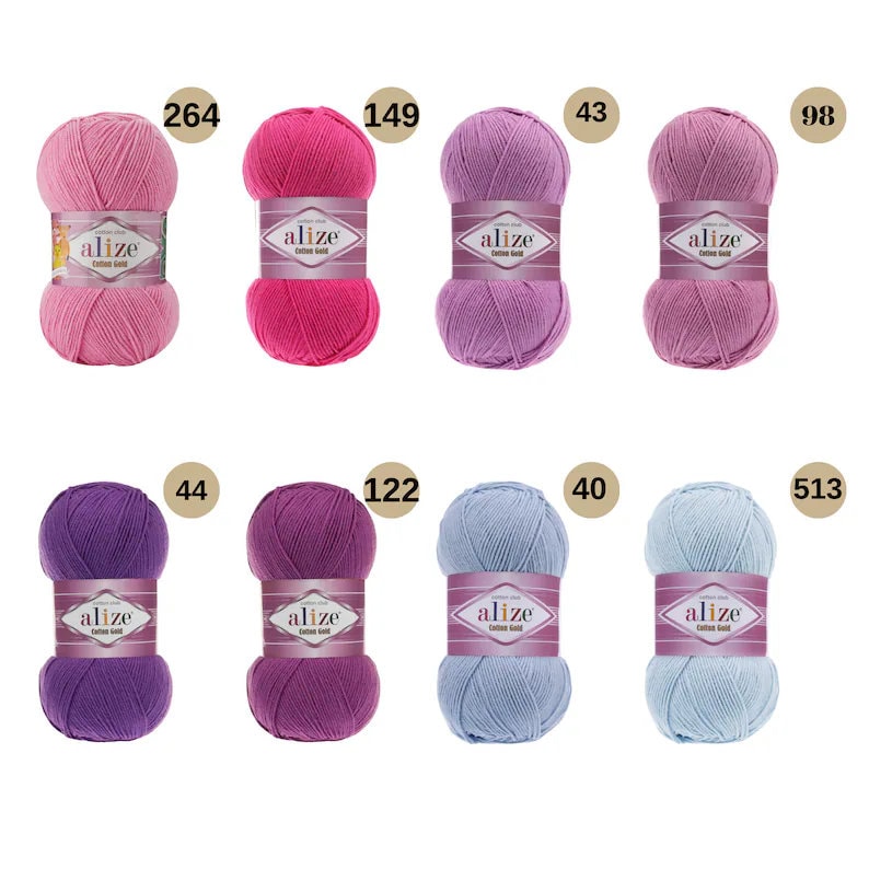 May include: A collection of eight balls of yarn in various shades of pink, purple, and blue. Each ball has a white label with the word "alize" and the number of the colour.