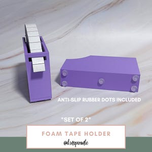 May include: Two purple foam tape holders with anti-slip rubber dots. One holder is upright, holding a roll of tape. The other is horizontal. Text on the image reads "FOAM TAPE HOLDER" and "*SET OF 2*".