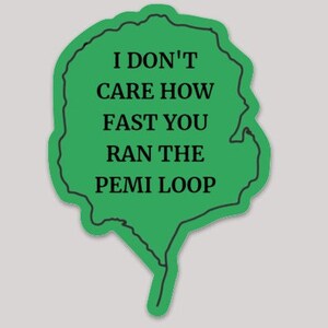 May include: Green sticker with a black outline in the shape of a leaf. The text on the sticker reads "I don't care how fast you ran the Pemi Loop."