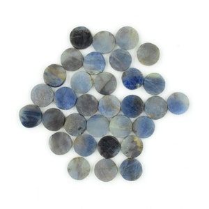 May include: A collection of round, blue and gray gemstone cabochons. The cabochons are smooth and polished, with a variety of shades of blue and gray.