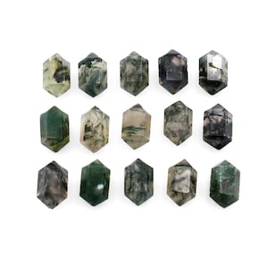 May include: Fifteen green, grey, and white moss agate tumbled stones in the shape of a hexagon.