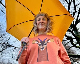 Reg The Roe Deer On A Sustainable Christmas Jumper For Women - Oversized - Organic Cotton - Plastic-Free Materials & Packaging
