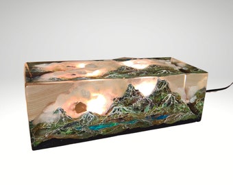 resin diorama, sculpture of a mountain with a small lake, resin sculpture, resin art, small lamp