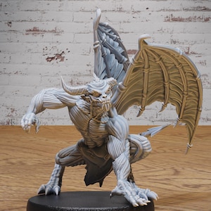 May include: A gray, detailed miniature of a gargoyle with wings outstretched. The gargoyle has a horned head, sharp teeth, and a muscular body. The base size is medium (25.5 mm). #5008