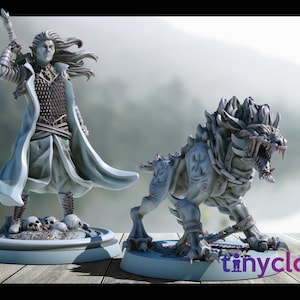May include: Two fantasy figurines: a warrior with a staff and a snarling beast. The warrior wears a long coat and stands on a base with skulls. The beast has a spiked back and is chained. Both are light gray.