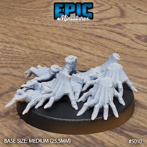 May include: A light blue miniature base with multiple hands reaching out. The base is black and has the text "BASE SIZE: MEDIUM (25.5MM)" and the Epic Miniatures logo. The product number is #5010.