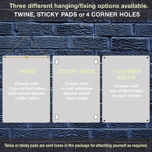 May include: Three different hanging options for a sign: twine, sticky pads, or pre-drilled holes in the corners. The sign is white with black text.