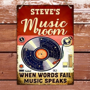 May include: A red, white and blue vintage-style sign with the text "STEVE'S Music room" and a record player graphic. The text "WHEN WORDS FAIL MUSIC SPEAKS" is at the bottom of the sign.