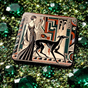May include: A square decorative plaque featuring a stylized illustration of a person in a long gown standing beside a black greyhound dog. The artwork uses geometric lines and a color palette of black, cream, teal, and burnt orange.