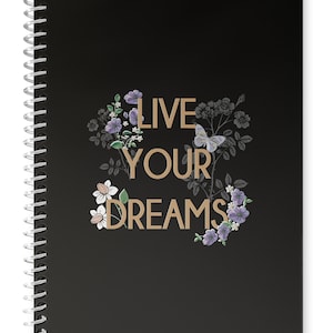 May include: Black spiral bound notebook with the text "LIVE YOUR DREAMS" in gold lettering surrounded by a floral design with butterflies.