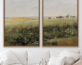 May include: Two framed landscape paintings depicting a field of wildflowers and a distant horizon. The paintings are in a muted colour palette of greens, browns, and blues.