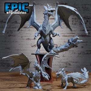 May include: A collection of gray dragon miniatures with detailed wings, claws, and scales. One dragon stands on a pedestal, while others are posed on a wooden surface. The logo "EPIC Miniatures" is visible in the top left corner.