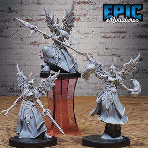 May include: A collection of gray miniature figurines of a fantasy warrior woman with large, ornate wings, a horned helmet, and flowing robes. One figure holds a spear, another a sword, and the third a staff. The Epic Miniatures logo is visible.
