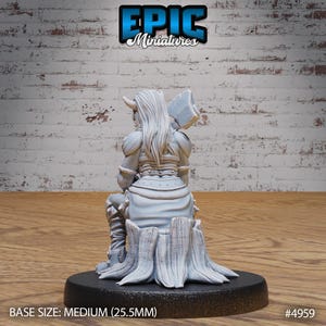 May include: A white, unpainted miniature figurine of a female warrior sitting on a tree stump. She is wearing armor and holding an axe. The base size is medium (25.5 mm).