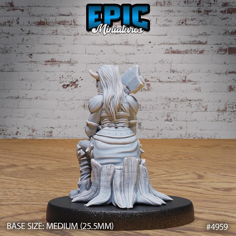 May include: A white, unpainted miniature figurine of a female warrior sitting on a tree stump. She is wearing armor and holding an axe. The base size is medium (25.5 mm).