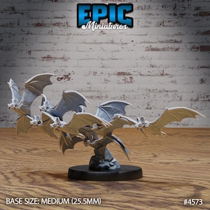 May include: A group of five gray bats in a flying formation, perched on a rocky base. The bats are sculpted in a realistic style and are part of a miniature set. The base is 25.5 mm in diameter. The miniature set is labeled "EPIC Miniatures" and "#4573".