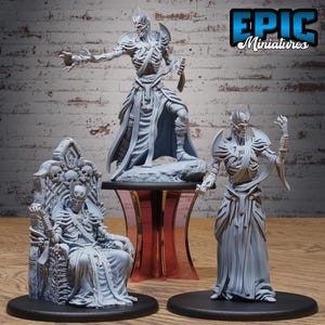 May include: Three gray miniature skeletal figures. One figure stands atop a pedestal, another stands on a black base, and the third sits on a throne adorned with skulls. The text "EPIC Miniatures" is in the upper right corner.