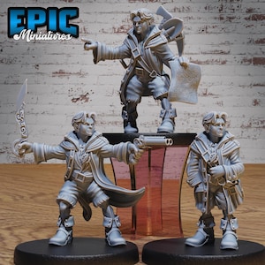 May include: Three gray painted miniature figures of people wearing coats and holding various items, including a sword, a gun, and a map. The figures are standing on round bases.