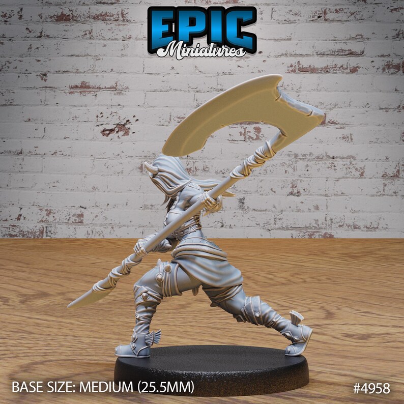 May include: A grey 3D printed miniature of a female warrior figure holding a large scythe. The figure is posed in a dynamic action pose with one leg raised and the other leg bent. The figure is wearing armor and a hooded cloak. The base size is medium (25.5mm). #4958